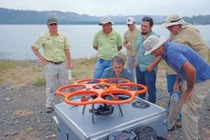 The breakwater project team reviews the flight plan for the Aibot X6 UAS.