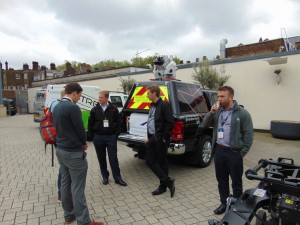 Several mobile mapping systems were parked in an outdoor area. Severn Partnership's Rollo Rigby (left-center) brought along their mapping rig featuring a Leica Pegasus:Two