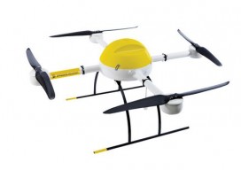 small micro drone with four rotors, black white and yellow