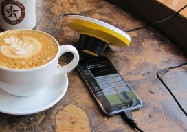 trimble app and bad elf GPS booster on iPhone screen with coffee on wooden table