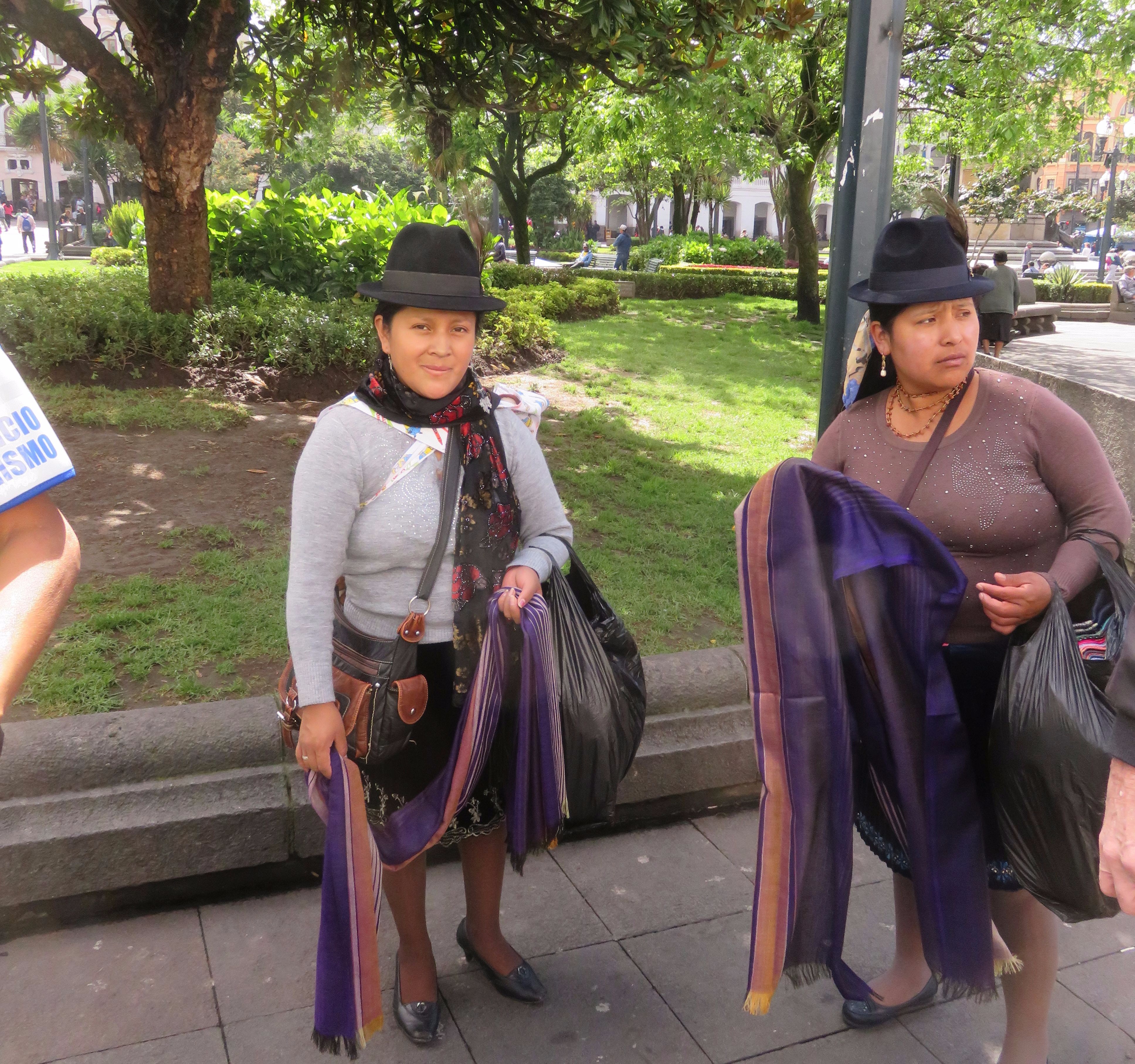 Local residents of Quito in traditional hats. enBays