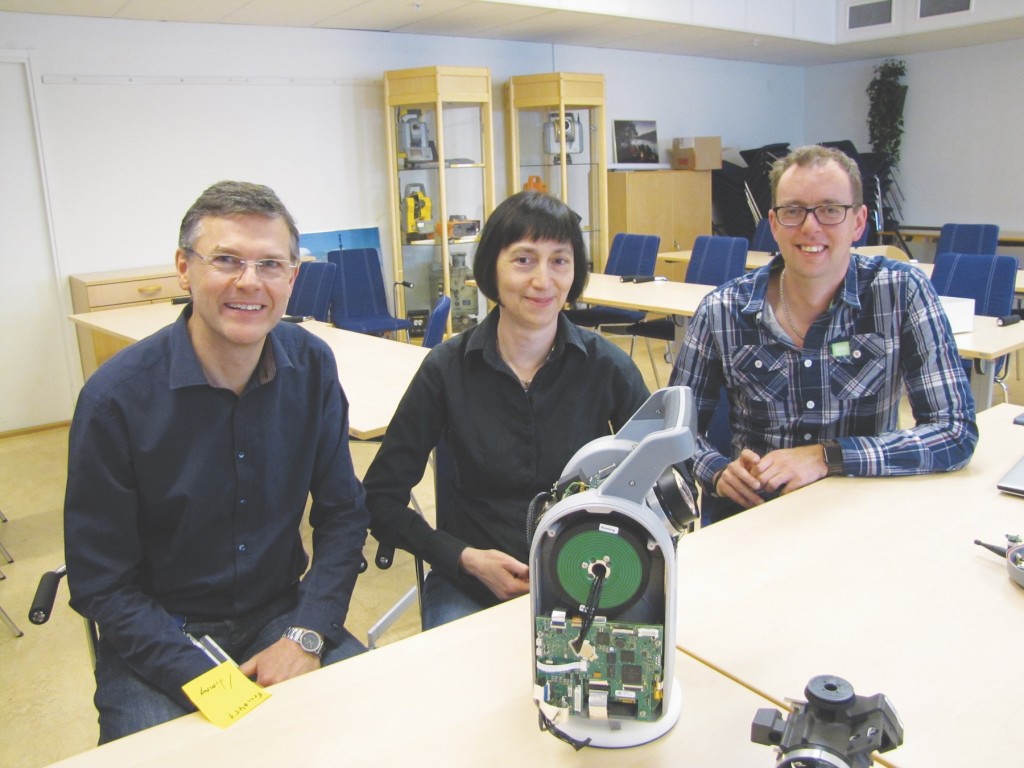 Left to right: Christian Grässer R&D specialist, Stella Einarsson system project manager for the SX10, and Mikael Nordenfelt R&D Specialist interviewed for this article. In the background: This meeting/training room also featured a mini-museum of noteworthy AGA/Geotronics/Trimble instruments. Credit: Schrock.