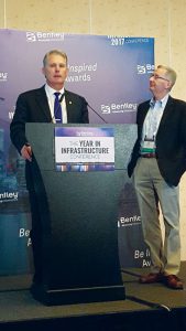 At the 2017 Year in Infrastructure conference, Topcon Positioning Systems CEO Ray O'Connor (left), and Bentley CEO Greg Bentley (right) announced the joint initiative of Constructioneering Academies, to begin in early 2018.