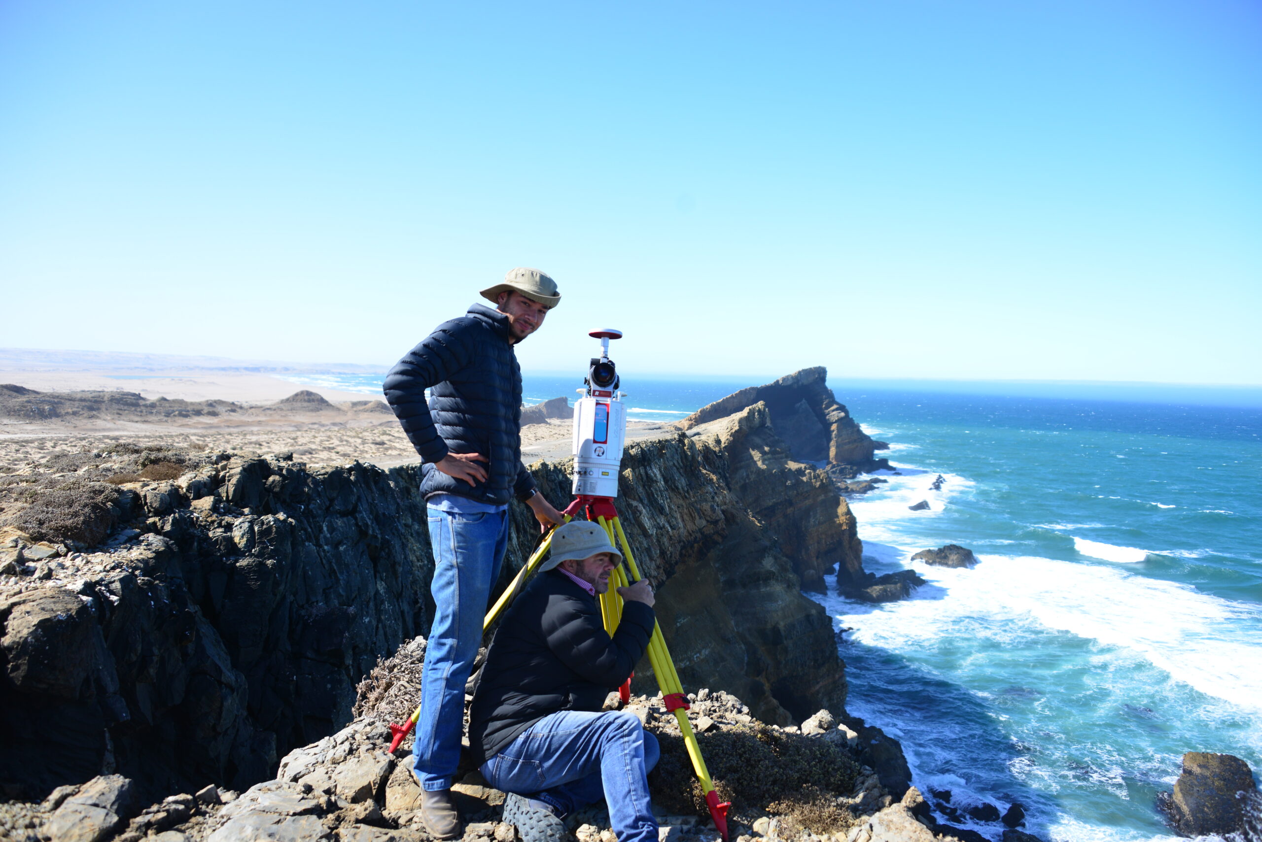 Herman Strydom and associate Guillaume van der Walt take a break and look out over the southern Atlantic Ocean with the RIEGL VZ-2000i on the remote Namibia coast. The remains are a part of Pomona, once a thriving diamond mining town in the African Sperrgebiet.