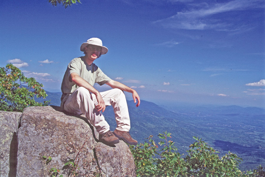 Matt Robinson, a GIS specialist in the Appalachian Trail park office of NSPS, sits on a rock outcrop on the top of Three Ridges, a mountain in central Virginia in George Washington National Forest, just off the AT.