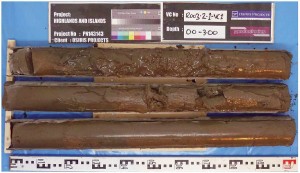 A vibracore system  collects core samples of underwater sediments.