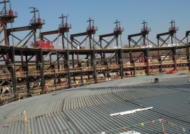 Forty-five feet below its final resting place, the top of the steel roof of Deep Space will be covered by layers of concrete and earth.