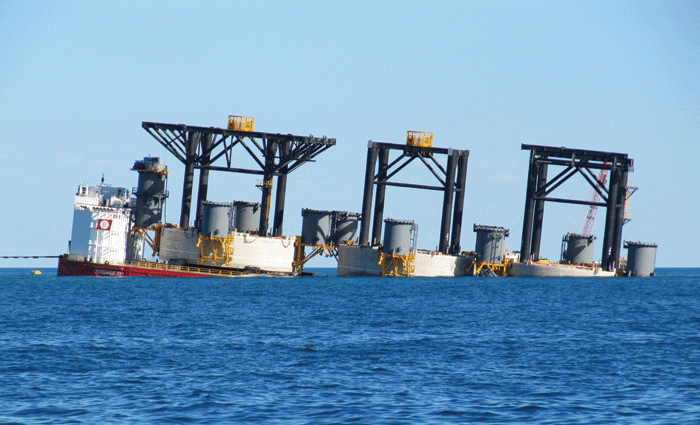 Caissons being floated off a semi-submersible barge. 