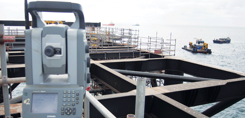 CADS Survey used two total stations facing each other to ensure that both ends of the 1.3-mile-long jetty met in the middle; this total station provided 1-cm accuracy when measuring from caisson to caisson.