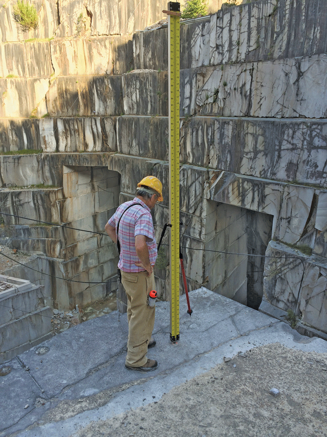 Readings from a 3-meter Invar rod provide controlled precision and help calculate the elevation of rods drilled in the rock.