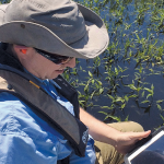 Lawrence Spencer puts the Trimble R1 GNSS receiver and iPad to work on the Kissimmee River.