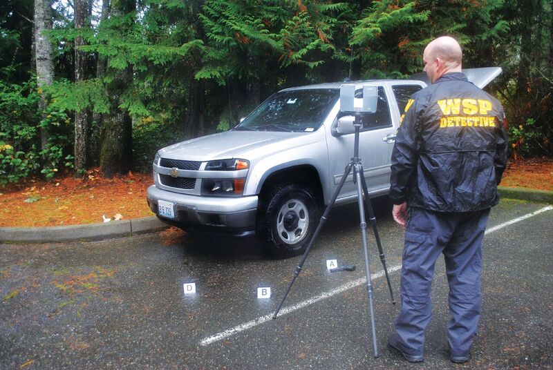 Rod Green uses a TX5 scanner to capture data; because the system can be operated by one person, it frees personnel for other tasks.