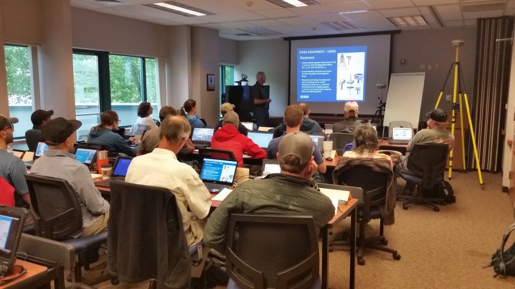 Instructor Paul Rydlund goes over GNSS concepts with the students in the Sacramento facility.