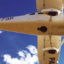 Looking up into the belly of a Cessna 206 airplane. The aerial photography camera is looking down through the hole.