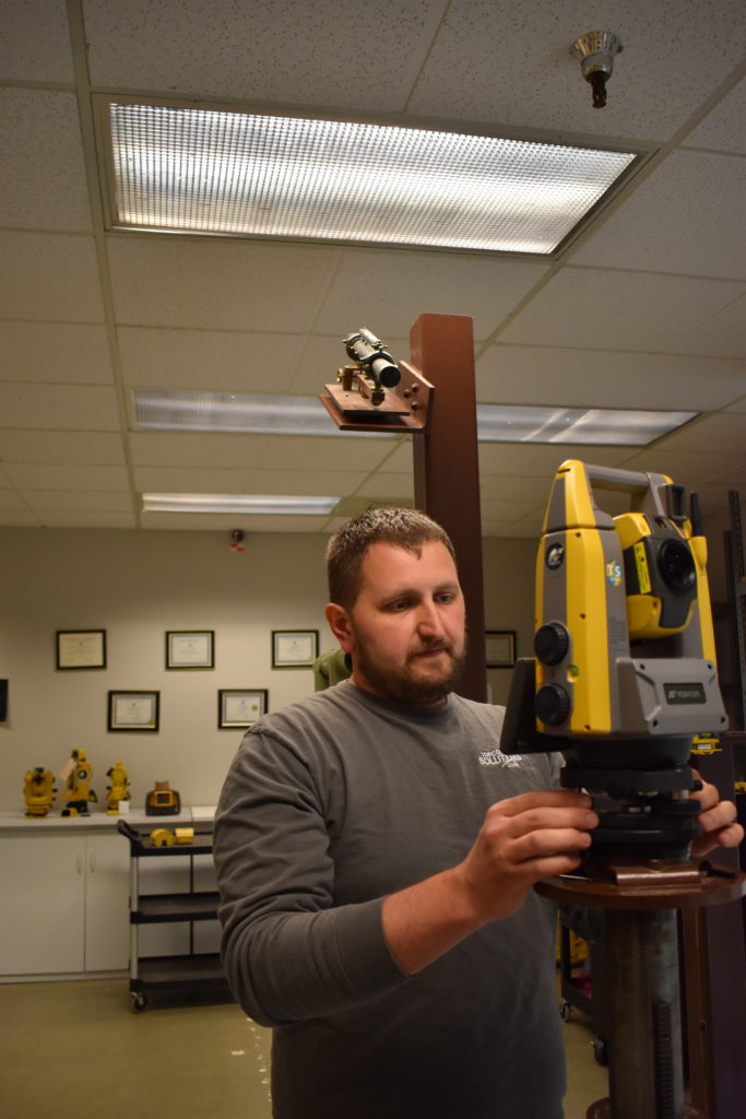 Andrey Borishkevich, also seen on this month's cover, service technician at the Topcon Solutions Store in Kent, Washington, performs annual service on a robotic total station.