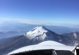 The Citation photogrammetry jet approaches Pico de Orizaba, the third highest peak in North America at 18,491 feet above sea level, on a photogrammetry mission.